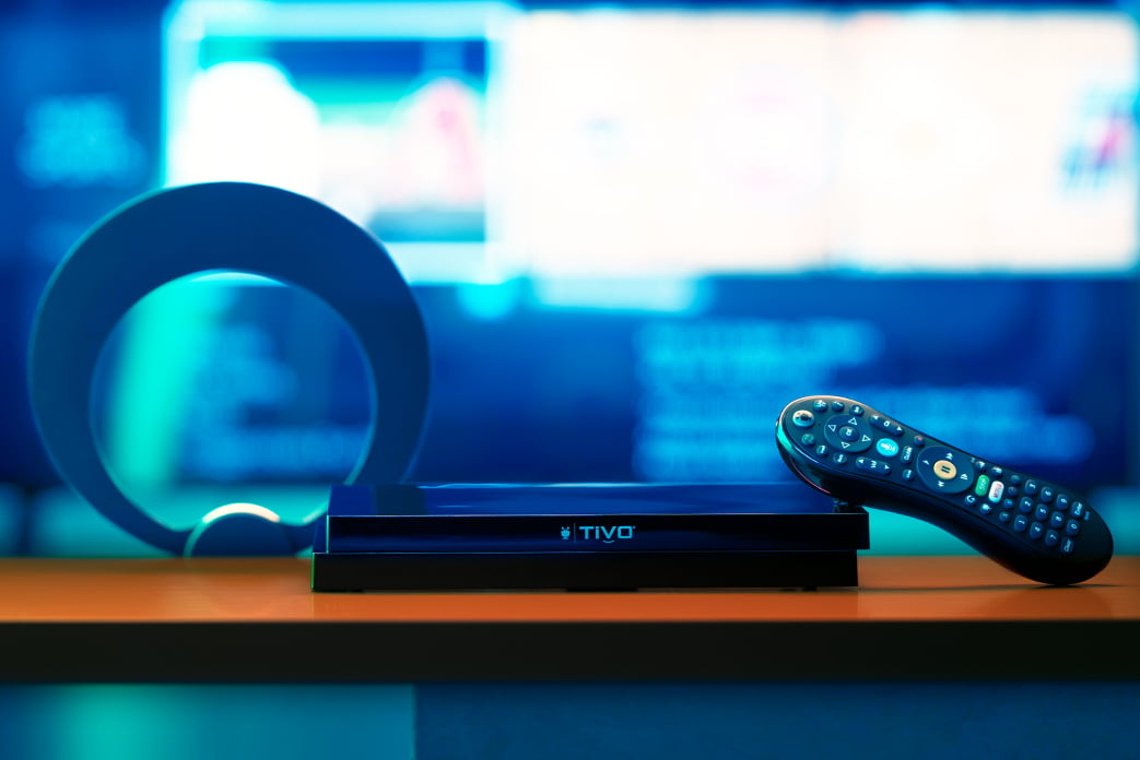 TiVo EDGE for antenna black dvr with remote on desk